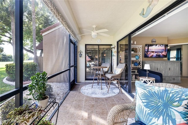 sunroom / solarium featuring vaulted ceiling and ceiling fan