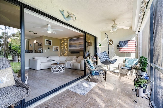 sunroom / solarium with ceiling fan