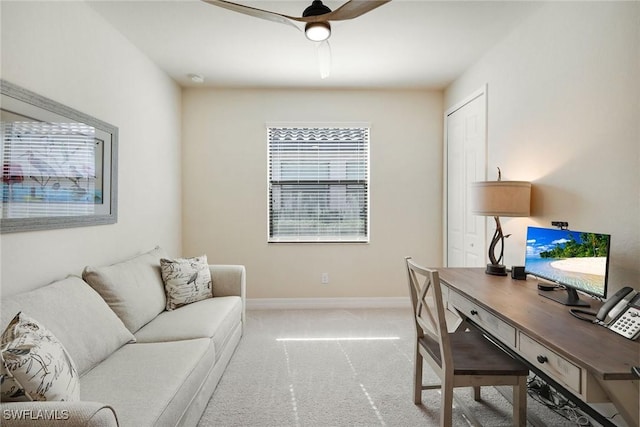 office featuring ceiling fan and light colored carpet