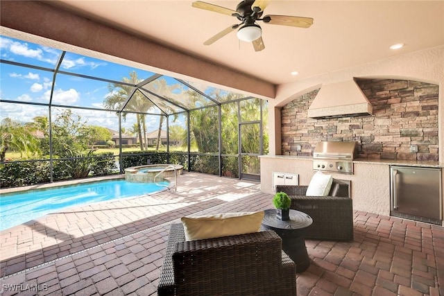 view of patio with an outdoor kitchen, a swimming pool with hot tub, a lanai, and area for grilling