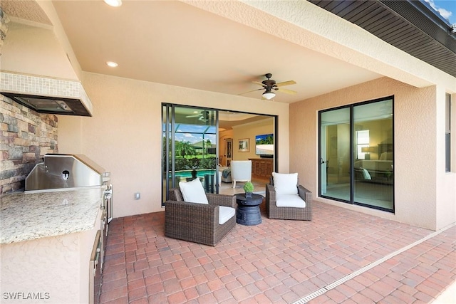 view of patio / terrace with ceiling fan and area for grilling