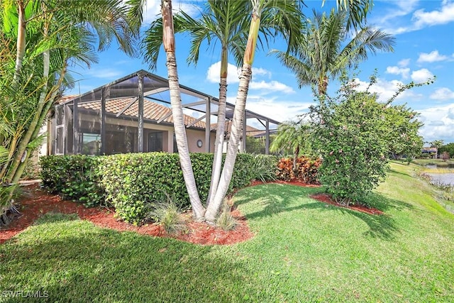 view of yard featuring a lanai