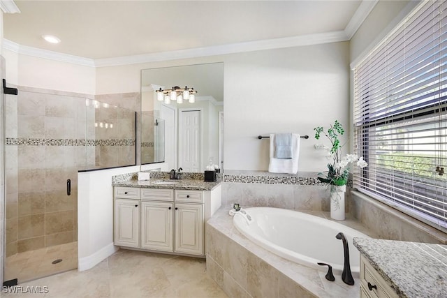 bathroom with vanity, ornamental molding, and independent shower and bath