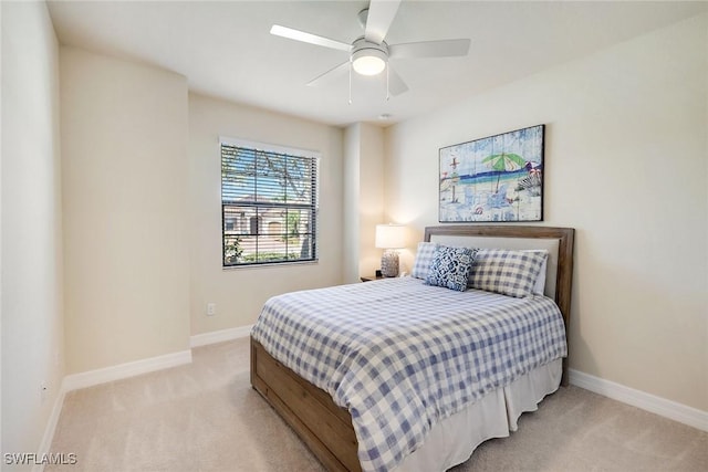 bedroom with light colored carpet and ceiling fan