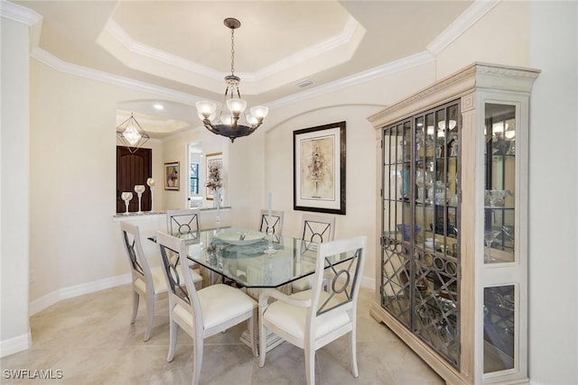 28131 Edenderry Ct, Bonita Springs, FL 34135 - dining space featuring a chandelier, a raised ceiling, ornamental molding, light tile patterned flooring, and baseboards