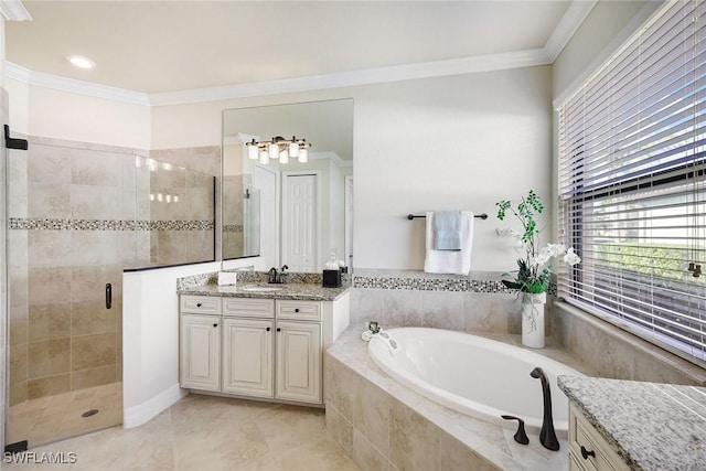 28131 Edenderry Ct, Bonita Springs, FL 34135 - bathroom featuring ornamental molding, vanity, a stall shower, a garden tub, and tile patterned flooring