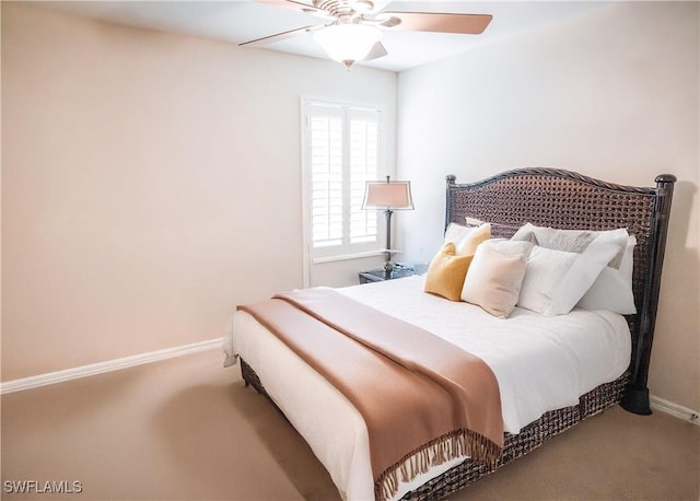 bedroom with ceiling fan and carpet