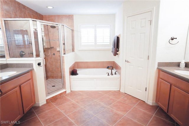 bathroom featuring vanity, tile patterned floors, and separate shower and tub