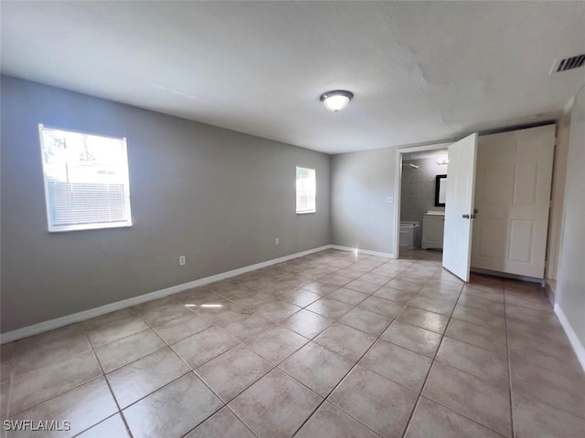 unfurnished bedroom with light tile patterned floors