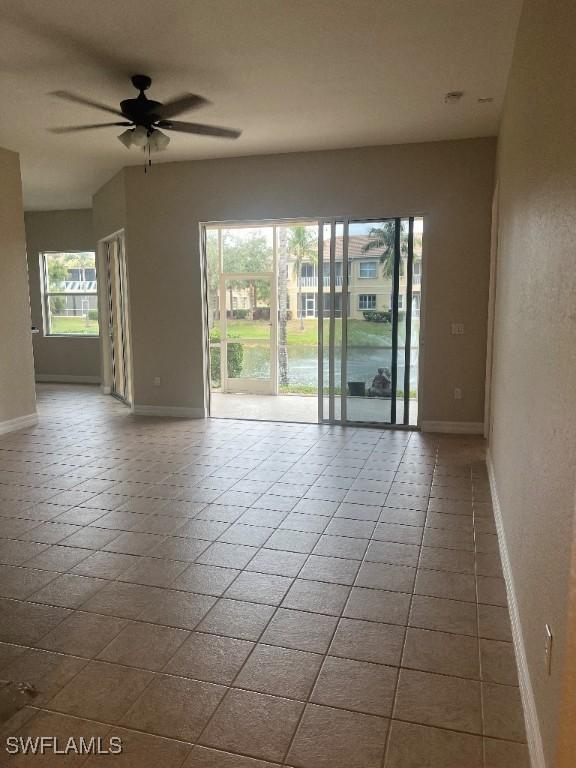 unfurnished room with ceiling fan