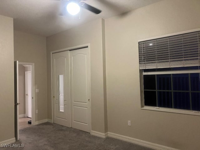 unfurnished bedroom with a closet, ceiling fan, and carpet