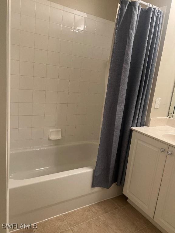 bathroom featuring vanity, tile patterned flooring, and shower / bath combo with shower curtain