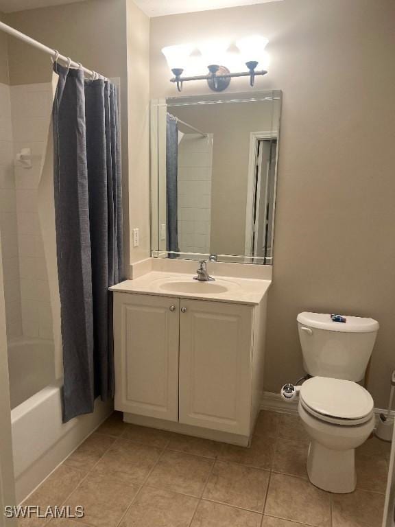 full bathroom with vanity, tile patterned flooring, toilet, and shower / bath combo with shower curtain