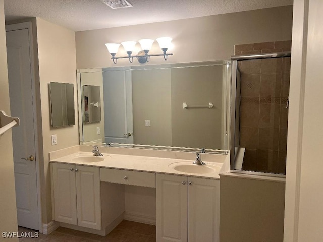 bathroom featuring walk in shower and vanity