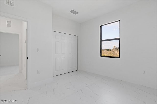 unfurnished bedroom featuring a closet