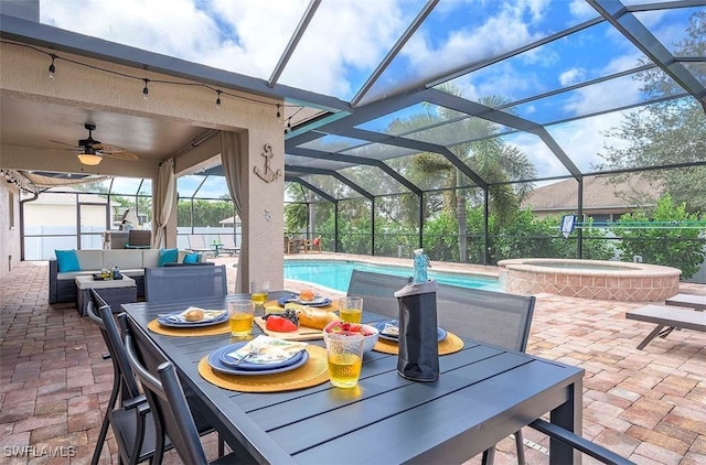 view of patio featuring a swimming pool with hot tub, an outdoor living space, and a lanai