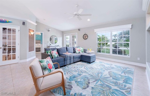 living room with french doors, ceiling fan, lofted ceiling, and light tile patterned floors