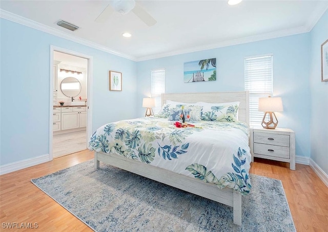 bedroom featuring crown molding and multiple windows