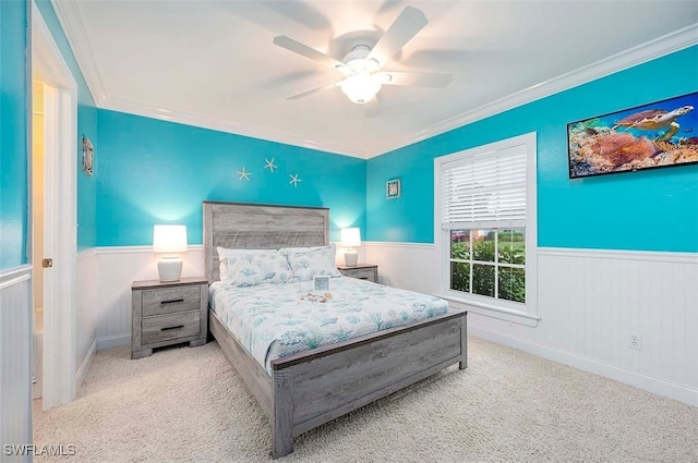 bedroom with ceiling fan, light colored carpet, and ornamental molding