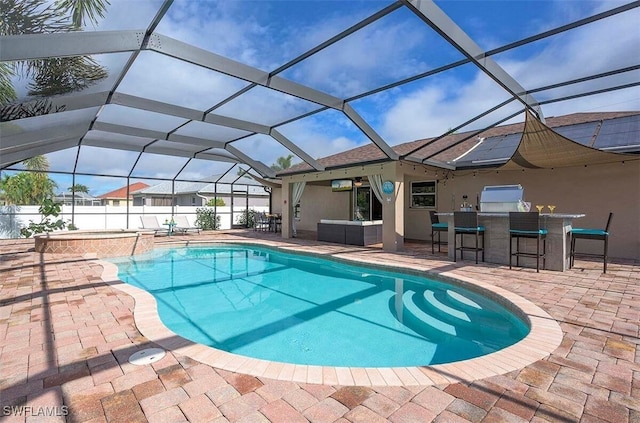 view of pool with a patio, a lanai, and an outdoor bar