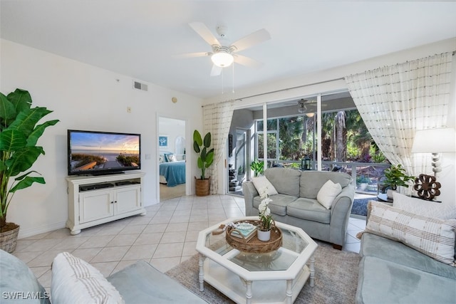 tiled living room featuring ceiling fan