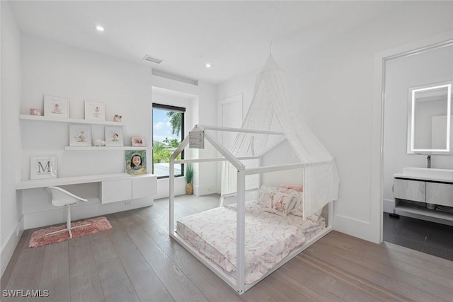 bedroom featuring wood-type flooring