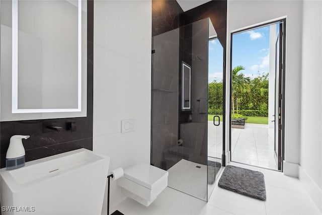 bathroom featuring sink, tile walls, a shower with door, tile patterned flooring, and decorative backsplash