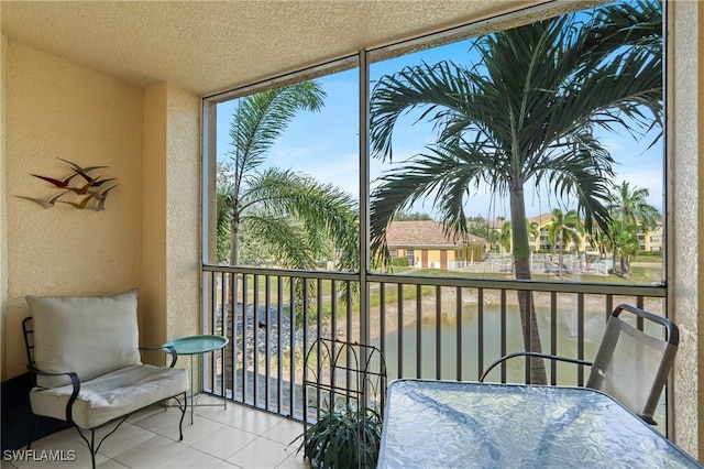balcony featuring a water view