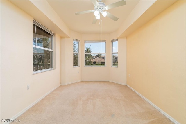 carpeted empty room with ceiling fan