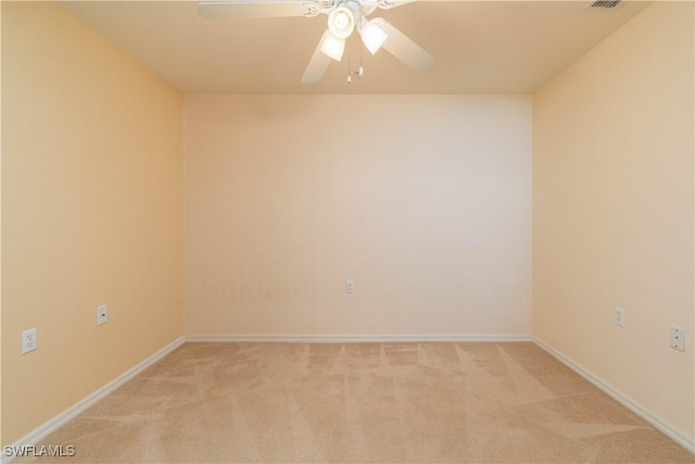 carpeted empty room with ceiling fan