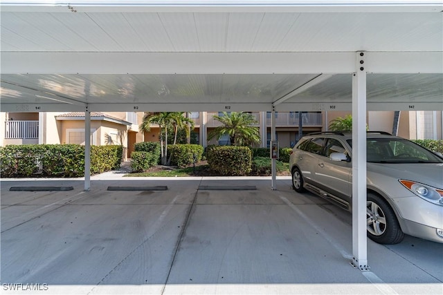 view of vehicle parking with a carport