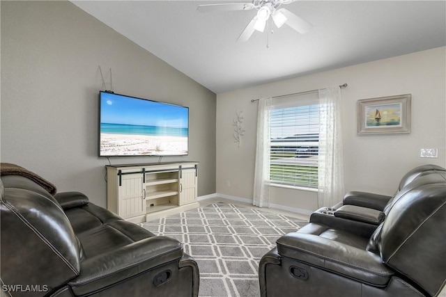 living room featuring vaulted ceiling and ceiling fan