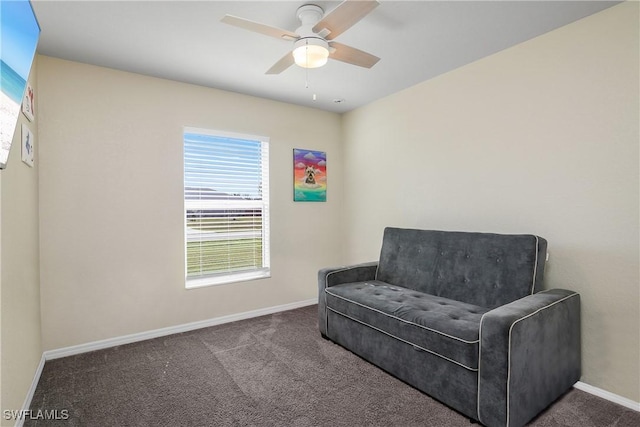 sitting room featuring ceiling fan and carpet flooring