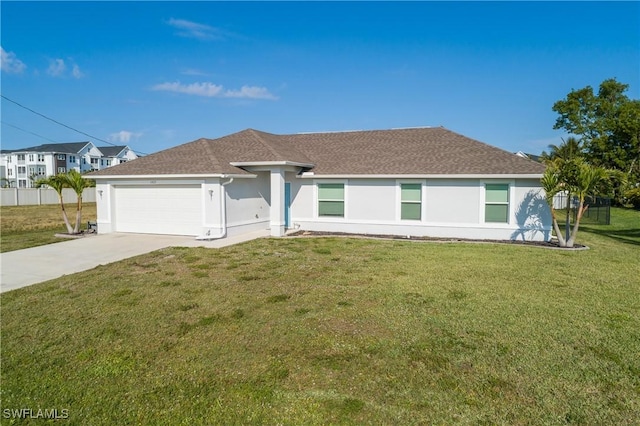 ranch-style house with a garage and a front lawn