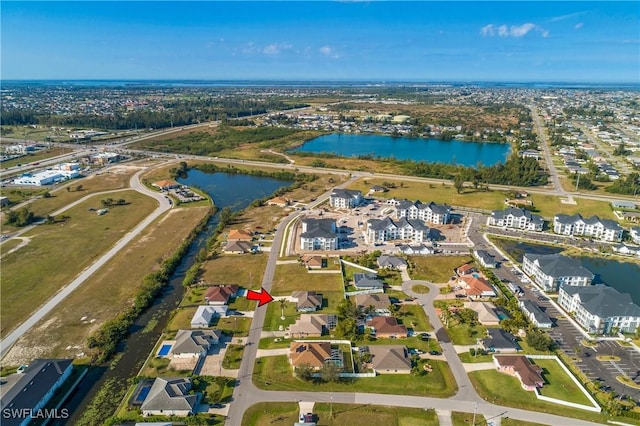 birds eye view of property featuring a water view