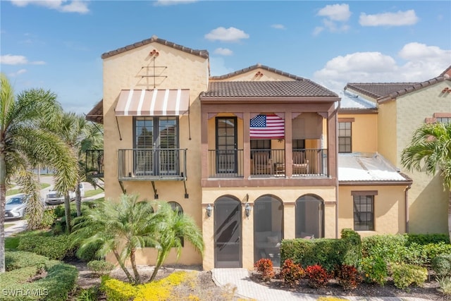 view of front of property with a balcony