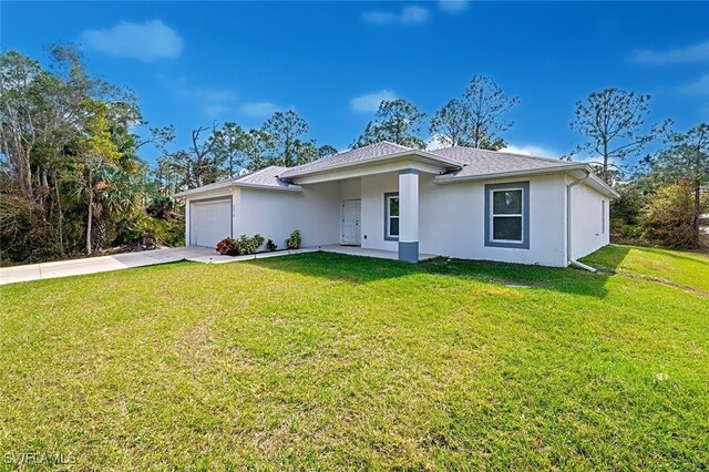 ranch-style home with a garage and a front yard