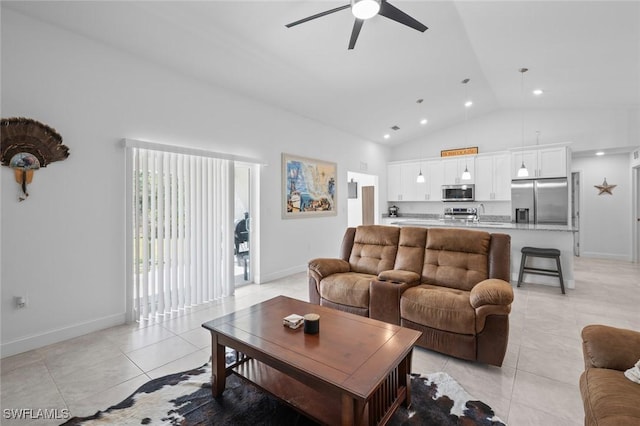 tiled living room with high vaulted ceiling and ceiling fan