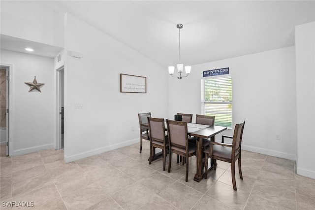 tiled dining room featuring a chandelier and vaulted ceiling