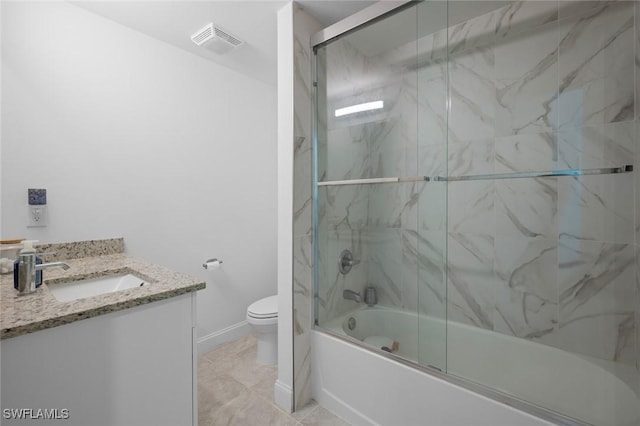 full bathroom with bath / shower combo with glass door, vanity, and toilet