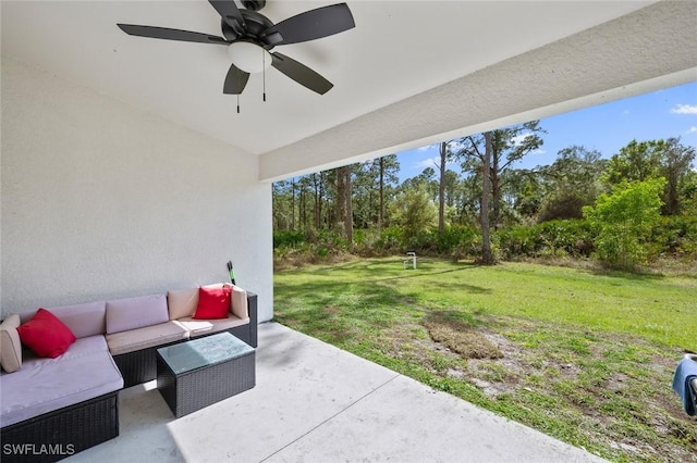 view of patio with an outdoor living space and ceiling fan