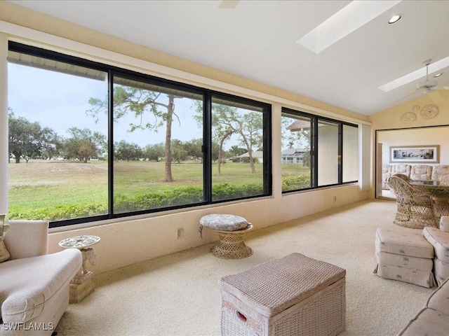 sunroom / solarium with lofted ceiling with skylight