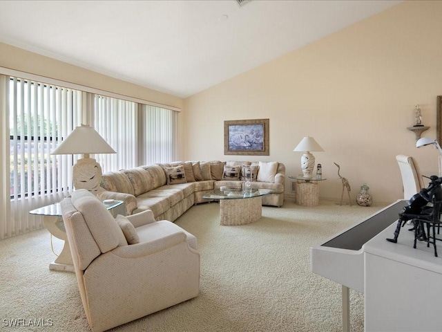 carpeted living room with vaulted ceiling