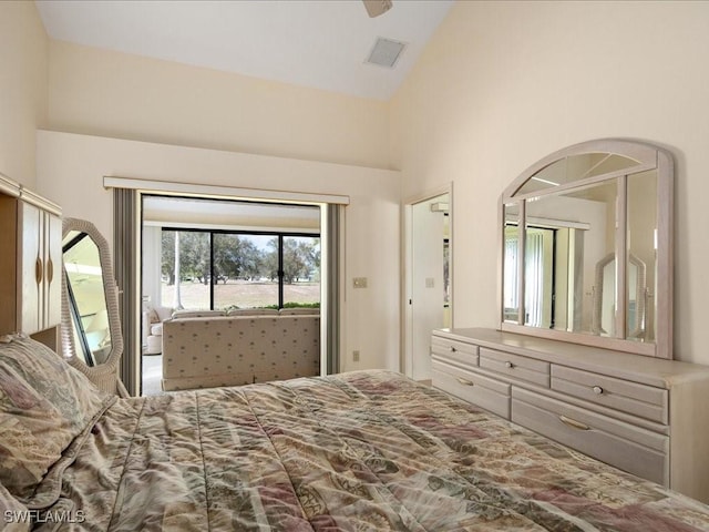 bedroom with access to outside and high vaulted ceiling