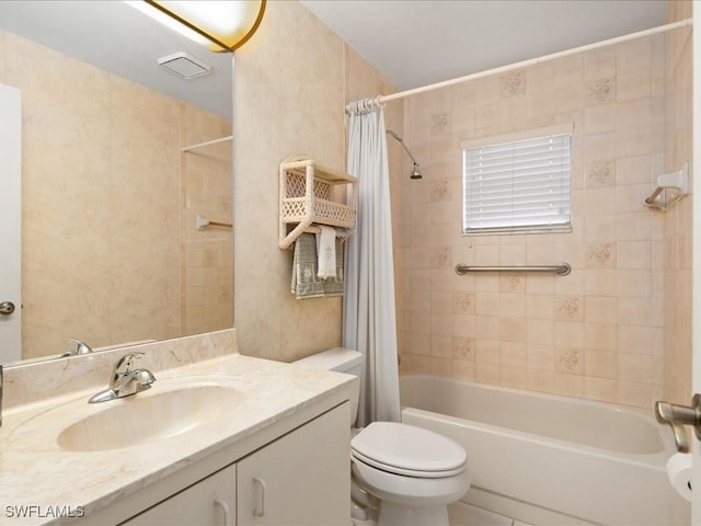 full bathroom with vanity, toilet, and shower / bath combo with shower curtain