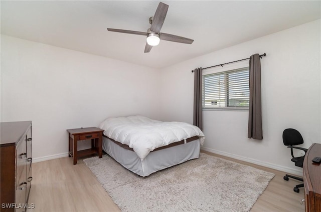 bedroom with ceiling fan and light hardwood / wood-style floors