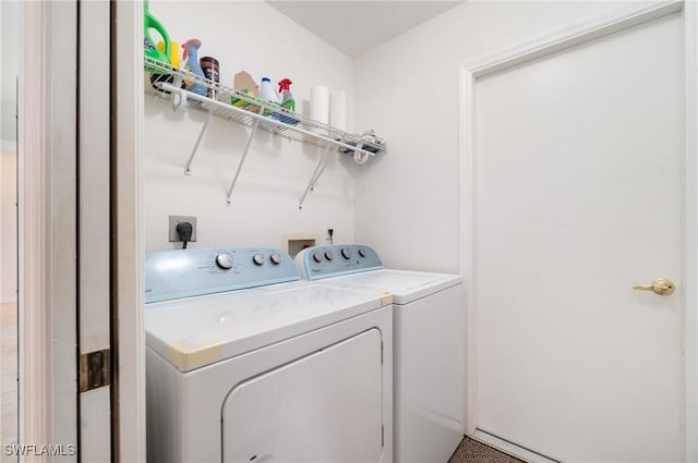 clothes washing area featuring washing machine and clothes dryer