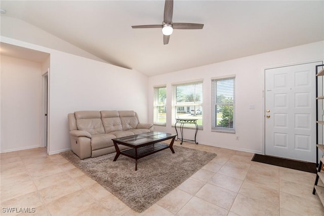 living room with light tile patterned flooring, ceiling fan, and vaulted ceiling