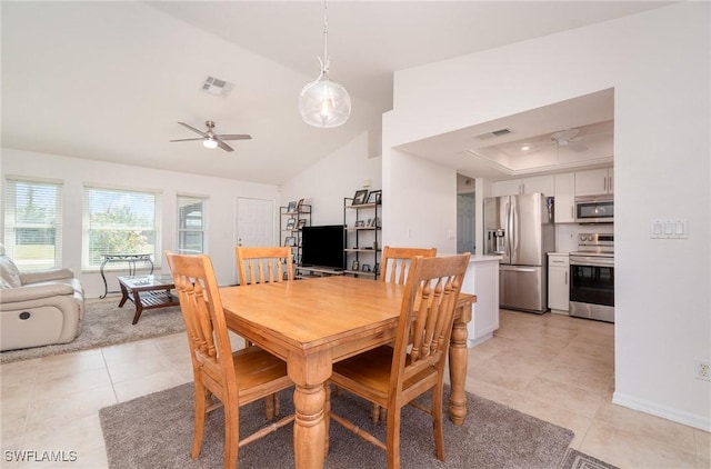 dining area with lofted ceiling, ceiling fan, and light tile patterned flooring