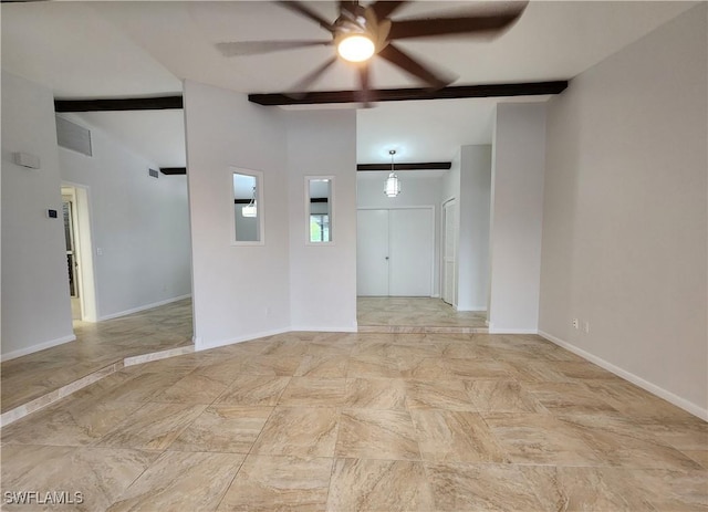 spare room featuring ceiling fan and beamed ceiling